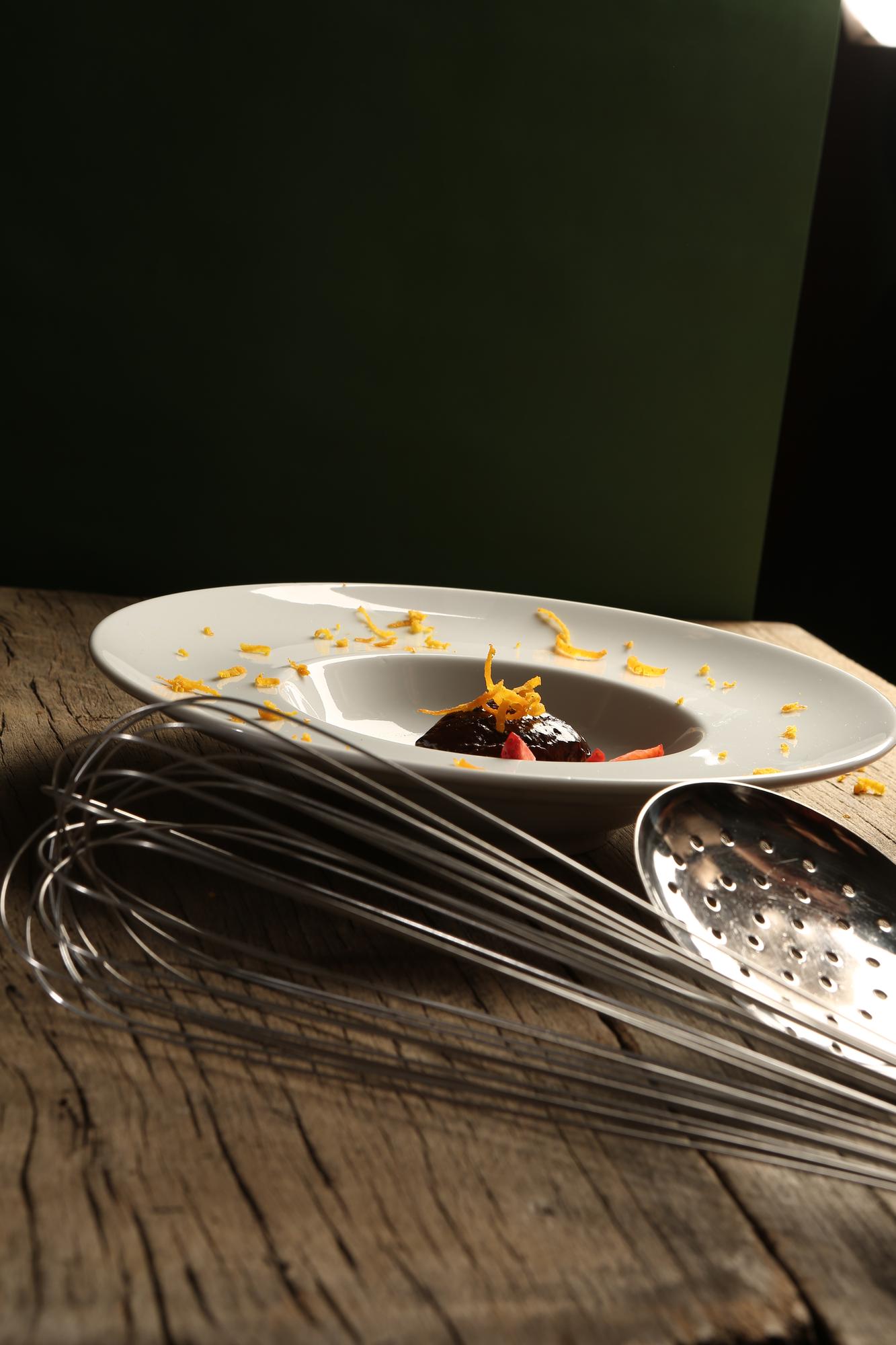 Studio kitchen counter with plated tasting menu