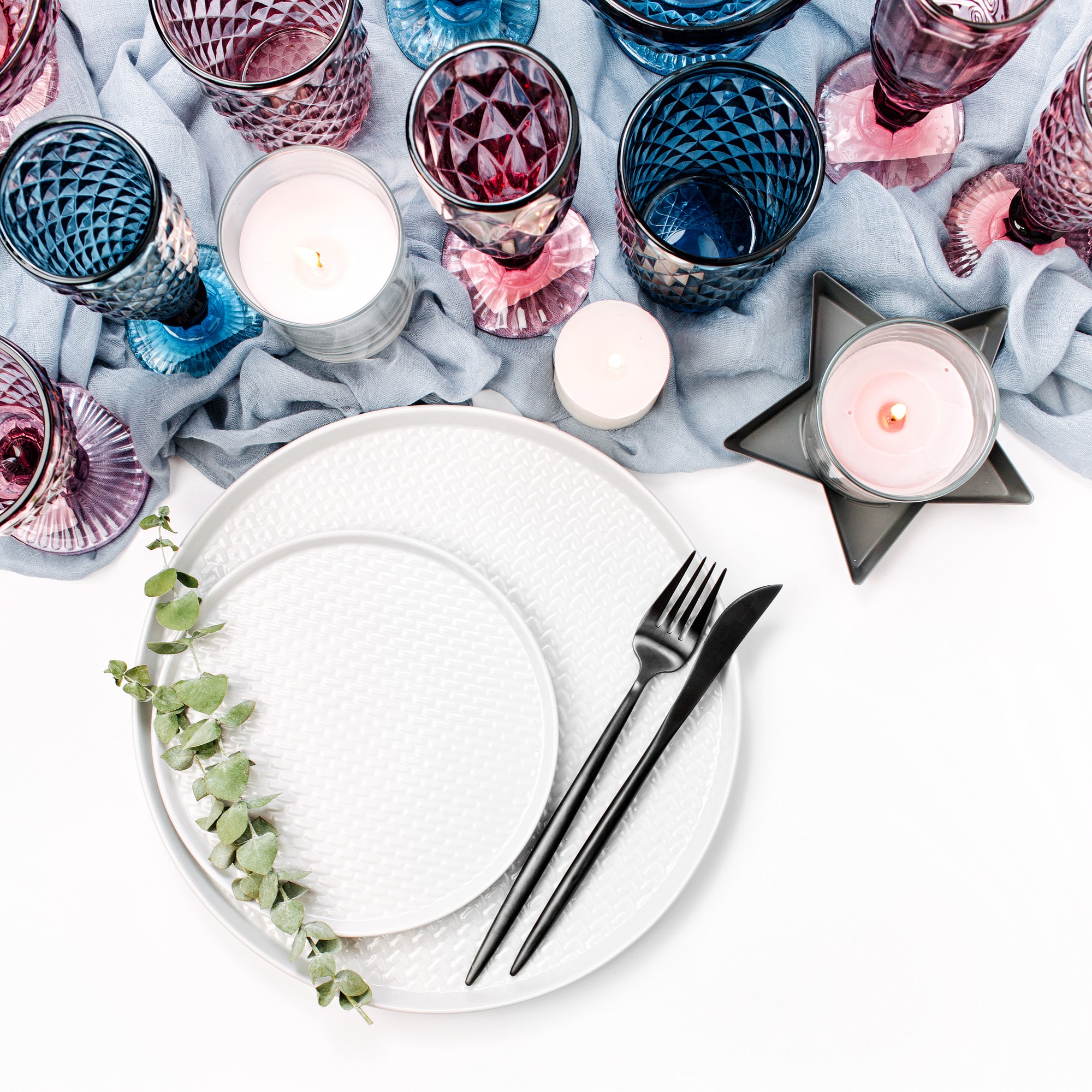 Tasting menu setup with candles and plates